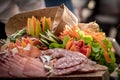 Buffet snack appetizer with salami sliced, jam sliced and bresaola on wooden board Royalty Free Stock Photo