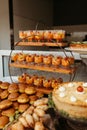 Buffet table with assorted pastries, fruit cups, and cheesecake. Royalty Free Stock Photo