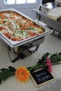 Buffet table of baked rigatoni in warmer Royalty Free Stock Photo