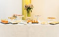 Buffet table with different salty and sweet snacks