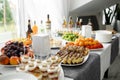 Buffet table..Fruits and pieces of cakes of various types Royalty Free Stock Photo