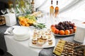 Buffet table..Fruits and pieces of cakes of various types Royalty Free Stock Photo