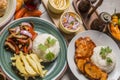 Buffet table sauted chicken with rice and french fries saltado de pollo Peruvian comfort food buffet traditional table