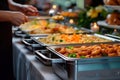 A buffet table with several trays of food on it, AI