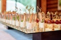 Buffet table with snacks, canape and appetizers at luxury wedding reception, copy space. Serving food at event. Catering banquet Royalty Free Stock Photo