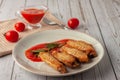 Buffolo wings with tomato sauce and rosemary sprig