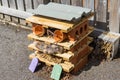 Bug hotel or house on a tarred surface Royalty Free Stock Photo