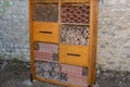 Bug hotel insect house wooden bug wood house ladybird bee home to butterfly hibernation in ecological garden Royalty Free Stock Photo