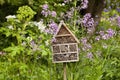 A bug house is a hotel for insects that provides shelter in the summer garden