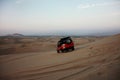 A buggie that is riding over the sand dunes in the desert nearby Ica in Peru with tourists Royalty Free Stock Photo