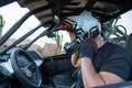 A buggy driver wears a helmet before setting off, extreme sport