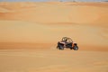 Buggy racing across desert Royalty Free Stock Photo