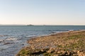 The Bugio Lighthouse and a vassal at Tagus Estuary in the morning Royalty Free Stock Photo