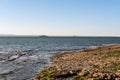 The Bugio Lighthouse and a vassal at Tagus Estuary in the morning Royalty Free Stock Photo