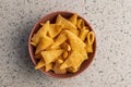 Bugles snack. Cone corn chips in bowl on kitchen table. Top view Royalty Free Stock Photo
