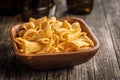 Bugles snack. Cone corn chips in bowl on wooden table Royalty Free Stock Photo