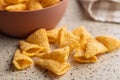 Bugles snack. Cone corn chips on kitchen table Royalty Free Stock Photo