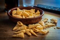 Bugles snack. Cone corn chips on wooden table Royalty Free Stock Photo