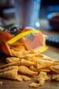 Bugles snack. Cone corn chips on wooden table Royalty Free Stock Photo
