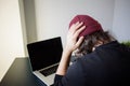 Bugs and errors in the development. A young programmer in the workplace has problems at work