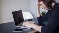 Bugs and errors in the development. A young programmer in the workplace has problems at work