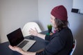 Bugs and errors in the development. A young programmer in the workplace has problems at work