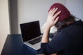 Bugs and errors in the development. A young programmer in the workplace has problems at work