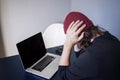 Bugs and errors in the development. A young programmer in the workplace has problems at work