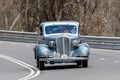 1935 Buick 46S Coupe driving on country road Royalty Free Stock Photo