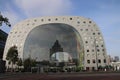 Buiding of the Markthal in Rotterdam with lof of fresh shops inside to sell food in site with nice architecture.