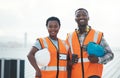 We build it better than anyone. Portrait of a confident young man and woman working at a construction site. Royalty Free Stock Photo