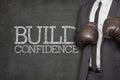 Build confidence on blackboard with businessman