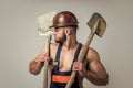 build and construction. sexy man with shovel. professional constructor or mechanic. builder engineer. muscular man Royalty Free Stock Photo