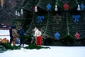 Build and decorate the city`s main Christmas tree. Workers hang garlands and decorations