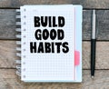 Build good habits symbol. Words written in the office notebook Royalty Free Stock Photo