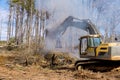 In order to build houses complex, it is necessary to clear the land for burning trees that have been uprooted for the Royalty Free Stock Photo