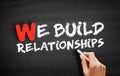 We Build Relationships text on blackboard Royalty Free Stock Photo