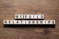 We build relationships - word concept on building blocks, text Royalty Free Stock Photo