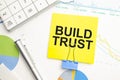 BUILD TRUST Concept. Calculator,pen and glasses on the white background Royalty Free Stock Photo