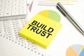 BUILD TRUST Concept. Calculator,pen and glasses on the white background Royalty Free Stock Photo
