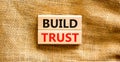 Build trust symbol. Concept words Build trust on wooden blocks on a beautiful canvas table canvas background. Business and build Royalty Free Stock Photo