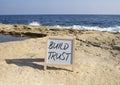 Build trust symbol. Build trust on white chalk blackboard. Beautiful sea background. Business and Build trust concept. Copy space