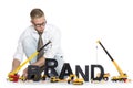 Brand start up: Businessman building brand-word.