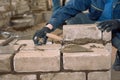 Build a wall of bricks. Students learn to lay bricks. Cement bond bricks. Spatula tamped cement. Profession builder Royalty Free Stock Photo