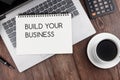 Build your business text on note pad Royalty Free Stock Photo