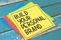 Build your personal brand, text words typography written on paper against wooden background, life and business motivational