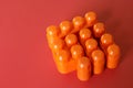 Buildable colored plastic blocks to play, build and organize on a red background as a concept of inclusion, diversity and pluralit Royalty Free Stock Photo