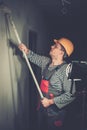 Builder applying paint Royalty Free Stock Photo