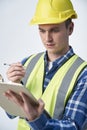 Builder Architect Making Notes On Clipboard Against White Background