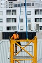 Builder assemble a construction tower crane